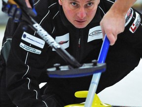 ED KAISER/EDMONTON JOURNAL

Wade White throws a rock during the B Event final of the Northern Alberta Curling Association men's playdown at the Ottewell Curling Club on Jan. 19, 2013.