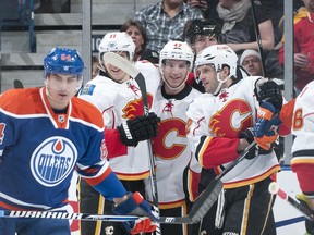Members of the Calgary Flames celebrate a goal against Edmonton on Saturday night. Calgary won 4-1. (Photo: Andy Devlin/Getty Images)