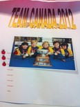 Cathy King's rink puts a lady bug sticker on its Team Canada poster each time it wins a game at the world senior women's curling championship. The team has three stickers up after three games so far.