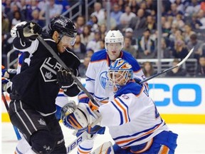 Los Angeles Kings centre Dwight King, left, tries to get a shot in on Edmonton Oilers goalie Devan Dubnyk during their game, Saturday, April 6, 2013.. The host Kings won 4-1.
Photo by Mark J. Terrill, Associated Press