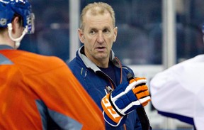 Edmonton Oilers head coach Ralph Krueger talks with players during training camp in Edmonton, on Monday January 14, 2013. When Kruger benched a pair of veterans recently he sent a clear message to the entire Oilers roster: it doesn't matter who you are, if you don't perform to his expected standards, don't expect to stay in the lineup. THE CANADIAN PRESS/Jason Franson