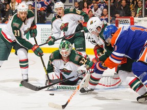Minnesota Wild netminder Niklas Backstrom had plenty of help repelling Oilers attackers, who managed just 19 shots on the night. Devan Dubnyk could only wish. (See comparative picture at bottom.)