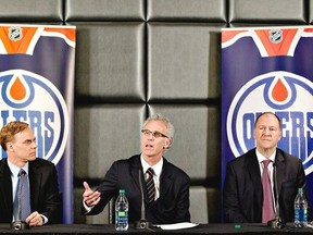 Edmonton Oilers new senior vice-president Scott Howson, left, new general manager Craig MacTavish and team president Kevin Lowe (right)attend a press conference in Edmonton, Alta., on Monday April 15, 2013. THE CANADIAN PRESS/Jason Franson