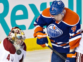 Phoenix Coyotes goalie Mike Smith makes the save on Edmonton Oilers forward Taylor Hall during NHL action at Rexall Place on Wednesday, April 10, 2013. The Coyotes won 3-1. Photo by Jason Franson, The Canadian Press