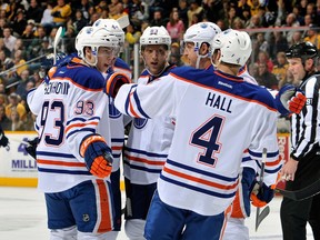 Members of the Edmonton Oilers celebrate a goal against the Nashville Predators. (Photo: Frederick Breedon/Getty Images)