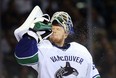 Goaltender Cory Schneider of the Vancouver Canucks sprays water iin Game 4 of his team's playoff series against the San Jose Sharks on May 7, 2013. The Sharks defeated the Canucks 4-3 to sweep the series 4 games to 0. Photo by Christian Petersen, Getty Images