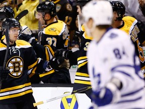 Boston Bruins forward David Krejci is congratulated by teammates after scoring May 1, 2013, in Game 1 of their NHL playoff game against the visiting Toronto Maple Leafs. Krejci has 10 points in four games against the Leafs thus far in the series. Photo by Jared Wickerham, Getty Images