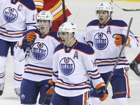 Edmonton Oilers' Taylor Hall, Jordan Eberle and Ryan Nugent-Hopkins celebrate a goal. (Photo: Mike Ridewood/Getty Images)