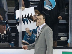 NHL coaching is not so much a dog-eat-dog as a Shark-eat-Orca world. Alain Vigneault's final departure from behind the Vancouver Canucks' bench didn't get a whole lot of sympathy in the Shark Tank. (Photo: Christian Petersen/Getty Images North America)