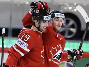 Justin Schultz and Steven Stamkos celebrate after teaming up on the game-winning goal against Sweden on Thursday. (Photo: The Canadian Press)