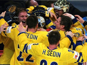 "Who cares?" Swedish hockey players, 2013 World Champions, certainly seem to.
(AFP PHOTO/ ALEXANDER NEMENOV/Getty Images)
