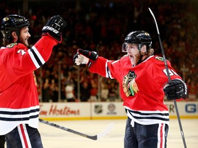 Brent Seabrook and Patrick Kane celebrate a goal in Chicago's game five win over Los Angeles. (Photo: Gregory Shamus/Getty Images)