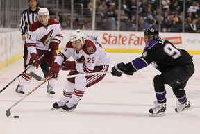 Garrett Stafford battling Ryan Smyth during the 2010-11 NHL season. (Photo: Jeff Gross/Getty Images)