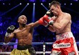 Floyd Mayweather Jr. lands a left jab against Robert Guerrero in the fourth round during a WBC welterweight title fight, Saturday, May 4, 2013, in Las Vegas. Photo by Isaac Brekken, Associated Press