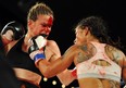 Jelena Mrdjenovich beats Melissa Hernandez for the WBC featherwieght world title after it was stopped because of a head butt and went to the score cards in the  KO boxing card Friday night at the Shaw Conference Centre in Edmonton , May 31, 2013. Photo by Bruce Edwards, Edmonton Journal