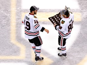 Patrick Kane (right, holding Conn Smythe Trophy) generated more scoring chances at even strength than any other player in the Stanley Cup Finals. Linemate Jonathan Toews led all centres. (Photo: Jared Wickerham/Getty Images North America)