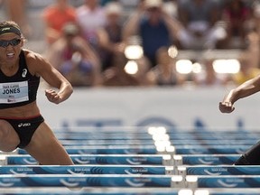 EDMONTON, ALBERTA:JUNE 29,2013 --LoLo Jones from the United States pushes past Angela Whyte of Canada to win the women's 100 metre hurdles at the Edmonton International Track Classic at Foote Field on June 29, 2013 in Edmonton.  Greg Southam/Edmonton Journal