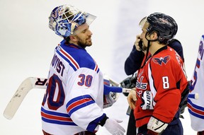 Second team All-Star Henrik Lundqvist congratulates Alex Ovechkin on his unlikely feat of making both All-Star teams, at two different positions. (Photo: Greg Fiume/Getty Images North America)