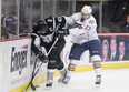 Curtis Hamilton separates an opponent from the puck. (Photo: Steven Christy/OKC Barons)