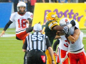 Hugh O’Neill #18 kicks as the Edmonton Eskimos battle the B.C. Lions in CFL action at Commonwealth Stadium in Edmonton, July 13, 2013.
Photograph by: Bruce Edwards, Edmonton Journal