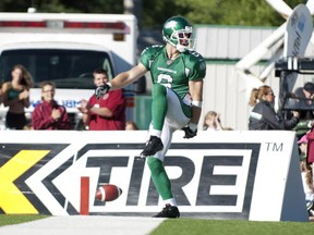 Saskatchewan Roughriders wide receiver Rob Bagg celebrates a touchdown against the Hamilton Tiger-Cats during the first half of CFL football action at Mosaic Stadium on Sunday, September 21, 2013 in Regina. THE CANADIAN PRESS/Liam Richards