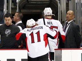 PITTSBURGH, PA - MAY 24:  Daniel Alfredsson #11 of the Ottawa Senators and Chris Neil #25 leave the ice after losing to the Pittsburgh Penguins  in Game Five of the Eastern Conference Semifinals during the 2013 NHL Stanley Cup Playoffs at Consol Energy Center on May 24, 2013 in Pittsburgh, Pennsylvania.  The Penguins defeated the Senators 6-2.  (Photo by Justin K. Aller/Getty Images)