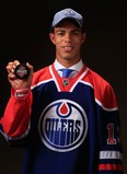 Darnell Nurse shows off his new sweater and cap last Sunday. Today he takes to the ice wearing the Oil drop. (Photo: Jamie Squire/Getty Images North America)