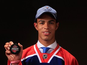 Darnell Nurse shows off his new sweater and cap last Sunday. Today he takes to the ice wearing the Oil drop. (Photo: Jamie Squire/Getty Images North America)