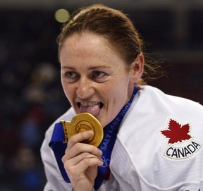 Canadian women's hockey team member Geraldine Heaney licks her gold medal after their win over the United States at the XIX Olympic Winter Games in Salt Lake City, Utah, on Feb 21, 2002. Geraldine Heaney is headed to the Hockey Hall of Fame. Heaney joins former NHL players Chris Chelios, Scott Niedermayer and Brendan Shanahan, while Fred Shero was selected in the builder category to round out the class of 2013. THE CANADIAN PRESS/Tom Hanson