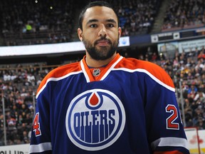 Defenceman Theo Peckham stands on the ice at Rexall Place before an Edmonton Oilers game against the Minnesoa Wild on February 21, 2013. Peckham is now an unrestricted free agent after the Oilers declined to make him a qualifying offer.