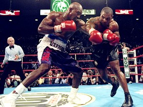 Evander Holyfield (left) battled Mike Tyson on June 28, 1997 in the infamous fight that ended with Tyson getting disqualified for biting Holyfield's ear.