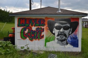A tribute to Don Snider, the Folk Fest's late production manager, mysteriously appeared on one of the buildings on the festival site.