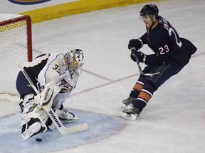 EDMONTON, ALTA.:  MARCH,1, 2011--Edmonton Oilers Linus Omark ¬† watches his game winning goal slide past Nashville Predators goaltender Pekka Rinne during the shoot out  in Edmonton on March 1, 2011. (Greg Southam / Edmonton Journal)