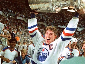 Wayne Gretzky hoists the Stanley Cup after the Edmonton Oilers win the Stanley Cup in May 1985.