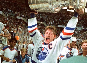Wayne Gretzky hoists the Stanley Cup after the Edmonton Oilers win the Stanley Cup in May 1985.