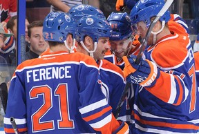 Defenceman Andrew Ference, left, celebrates an Edmonton Oilers goal with his tammates during a pre-season game against the visiting Winnipeg Jets on Sept. 23, 2013. Ference was named the captain of the Oilers late on Sept. 28.