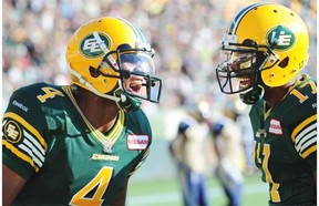 Adarius Bowman #4 and Shamawd Chambers #17 celebrate a touchdown as the Edmonton Eskimos battle the Winnipeg Blue Bombers at Commonwealth stadium in Edmonton, September 14, 2013.
Photograph by: Bruce Edwards, Edmonton Journal