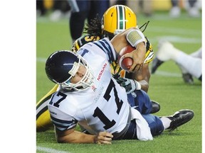 Edmonton Eskimos Marcus Howard sacks Toronto Argonauts QB Zach Collaros during CFL action at Commonwealth Stadium in Edmonton, September 28, 2013.
Photograph by: Ed Kaiser, Edmonton Journal