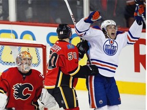 Ryan Jones celebrates the fact that hockey is back. (Photo: Jeff McIntosh, THE CANADIAN PRESS)