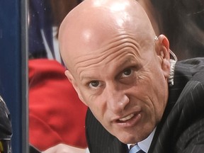 Assistant Coach Keith Acton of the Columbus Blue Jackets instructs his team during a game against the Vancouver Canucks on March 7, 2013 at Nationwide Arena in Columbus, Ohio.