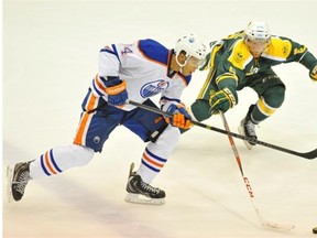 Darnell Nurse of the Edmonton Oiler prospects, breaks in on Ben Lindemulder of the University of Alberta Golden Bears in a exhibition hockey game at Clare Drake Arena in Edmonton.

Photograph by: Shaughn Butts, Edmonton Journal