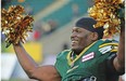 Odell Willis #41 celebrates with cheerleaders pom poms after the Edmonton Eskimos beat the Winnipeg Blue Bombers 25-7 at Commonwealth stadium in Edmonton, September 14, 2013.
Photograph by: Bruce Edwards, Edmonton Journal