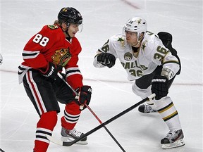 Philip Larsen looks to hit Chicago Blackhawks' Patrick Kane. (AP Photo/Charles Cherney)