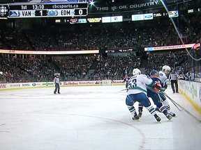 Dale Weise hits Taylor Hall in the head during last Saturday's game at Rexall Place.