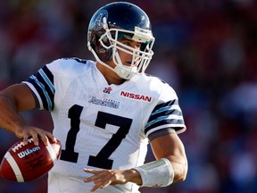 Toronto Argonauts' quarterback Zach Collaros, looks for a receiver during first quarter CFL football action against the Calgary Stampeders in Calgary, Alta., Saturday, Sept. 21, 2013. THE CANADIAN PRESS/Jeff McIntosh