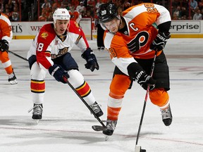 Shawn Matthias #18 of the Florida Panthers chases Claude Giroux #28 of the Philadelphia Flyers at the Wells Fargo Center on October 8, 2013 in Philadelphia.