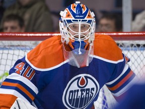 EDMONTON, CANADA - NOVEMBER 5:  Devan Dubnyk #40 of the Edmonton Oilers concentrates on the puck during warm-up before a game against the Detroit Red Wings at Rexall Place on November 5, 2010 in Edmonton, Alberta, Canada. The Wings won 3-1. (Photo by Andy Devlin/NHLI via Getty Images)