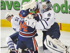 In your face! Leafs netminder James Reimer had all the answers for would-be Oilers snipers like Nail Yakupov, including a few physical battles along the way. (Photograph by: John Lucas, Edmonton Journal)