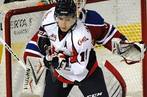 Lethbridge Hurricanes forward Jaimen Yakubowski tries to deflect the puck in front of Edmonton Oil Kings goalie Tristan Jarry during WHL action at Rexall Place in Edmonton, Sept. 29, 2013.