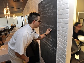 EDMONTON, ALTA: OCTOBER 4, 2010 -- Chef Scott Ards writing up the menu at The Marc, a new restaurant by restaurateur Patrick Saurette and his wife Doris at 9940 - 106 St. in Edmonton, October 4, 2010. (Ed Kaiser-Edmonton Journal)